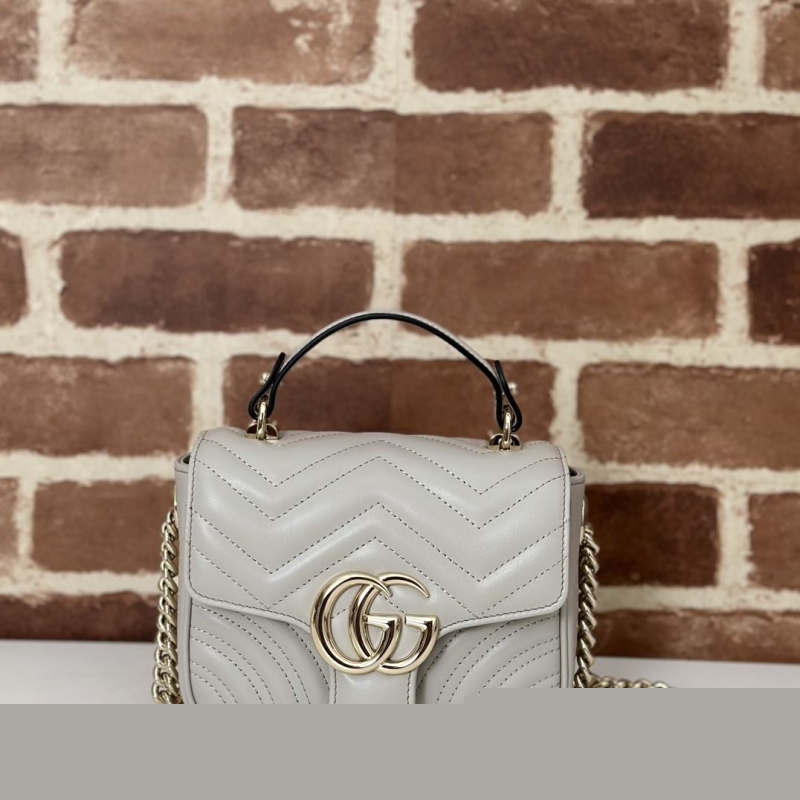 G*u*i top handle bags